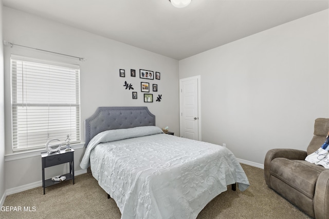 bedroom featuring light colored carpet