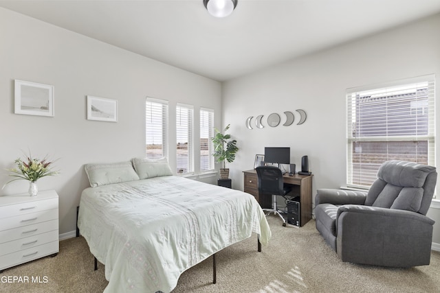 bedroom with light carpet