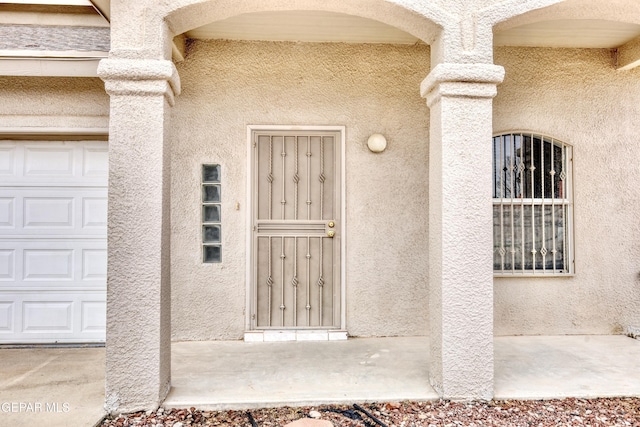 property entrance with a garage