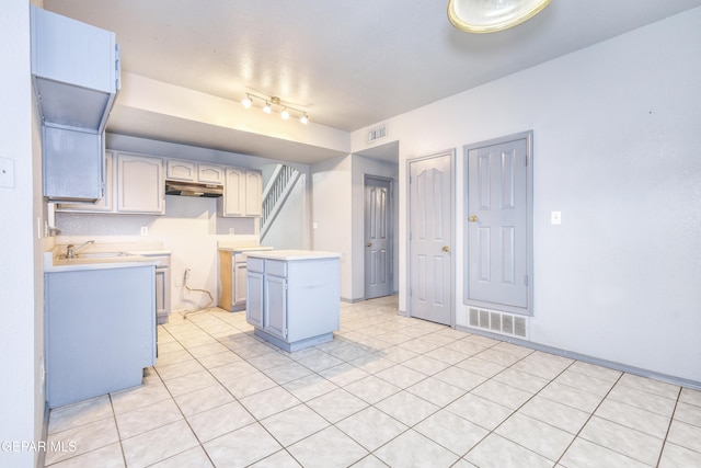 kitchen with sink and light tile patterned floors