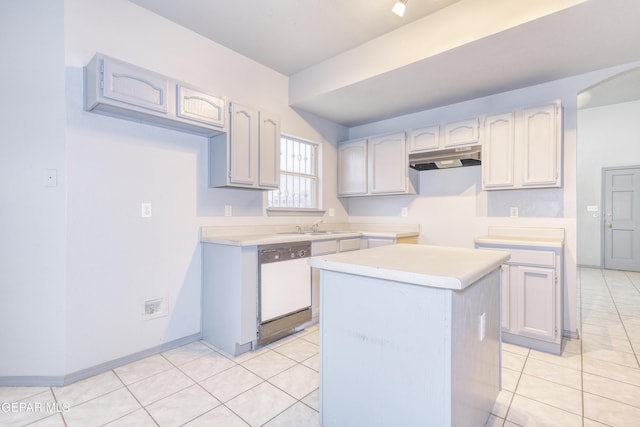 kitchen with a center island, white dishwasher, light tile patterned flooring, and sink