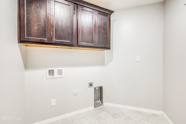 laundry room with cabinets, washer hookup, hookup for a gas dryer, and hookup for an electric dryer