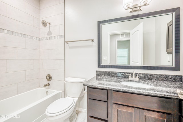 full bathroom with vanity, toilet, and tiled shower / bath