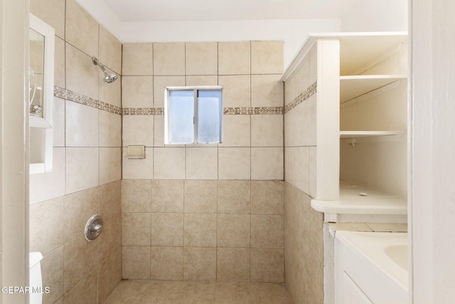 bathroom with a tile shower