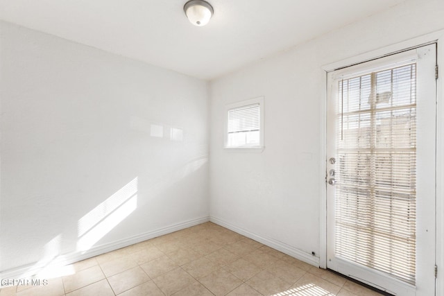 spare room with light tile patterned flooring