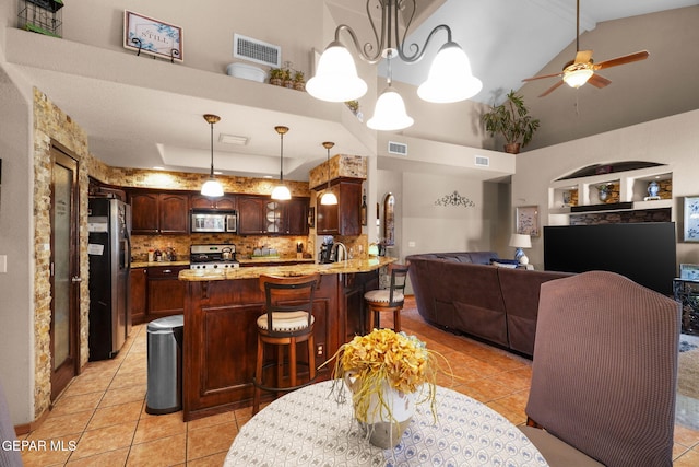 dining room with built in shelves, sink, high vaulted ceiling, ceiling fan, and light tile patterned floors