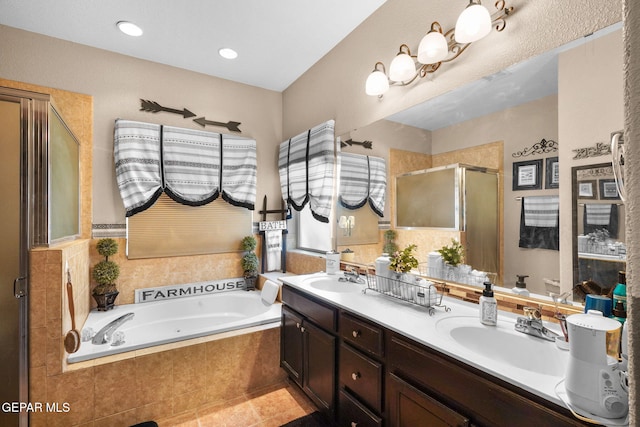 bathroom featuring vanity, independent shower and bath, and tile patterned flooring