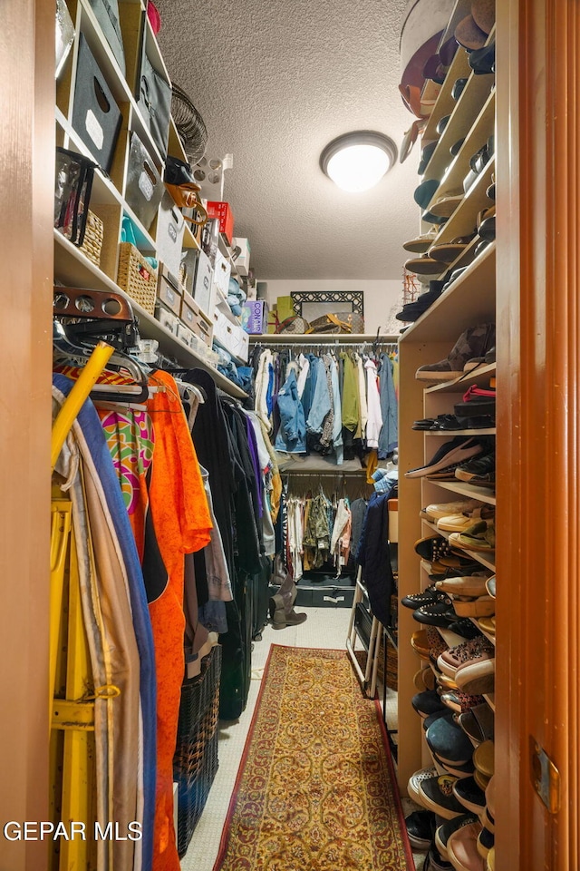 spacious closet with tile patterned flooring