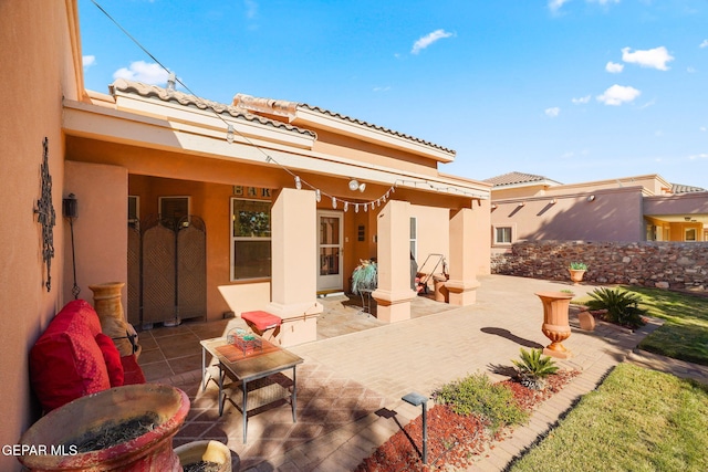 rear view of house with a patio