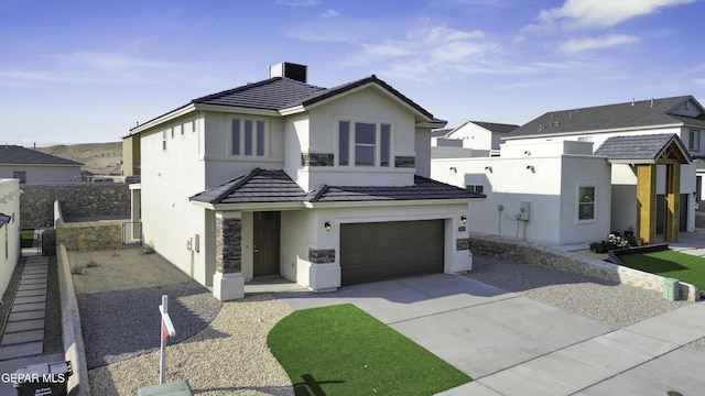 view of front of property featuring a garage