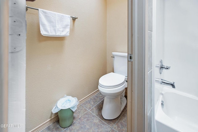 bathroom featuring tile patterned flooring and toilet