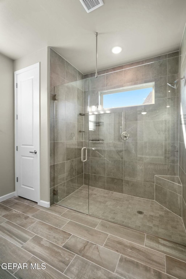 bathroom with an enclosed shower