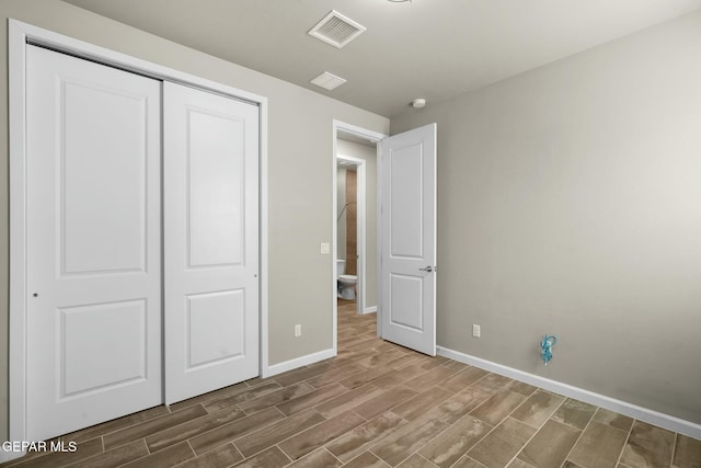 unfurnished bedroom with a closet