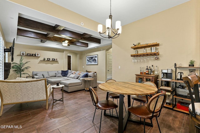 dining area with beam ceiling, ceiling fan with notable chandelier, and coffered ceiling