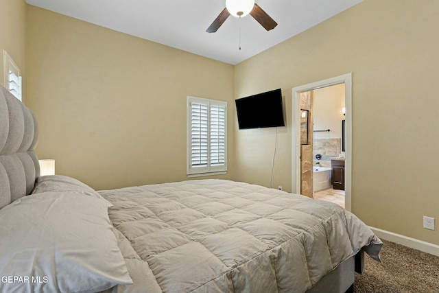 bedroom featuring ensuite bathroom, ceiling fan, and light colored carpet