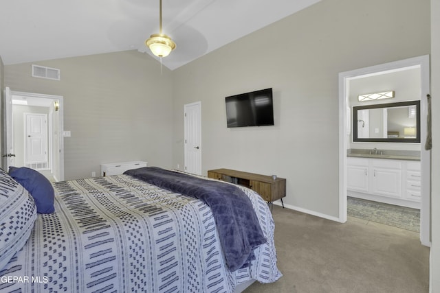 carpeted bedroom featuring ensuite bathroom, ceiling fan, lofted ceiling, and sink