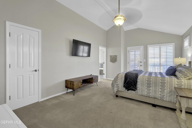 carpeted bedroom with ceiling fan and vaulted ceiling