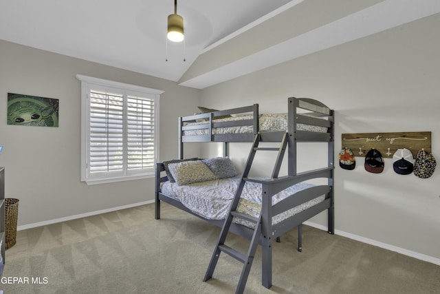 carpeted bedroom featuring ceiling fan and lofted ceiling