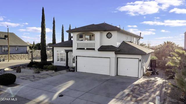 view of front facade with a balcony and a garage