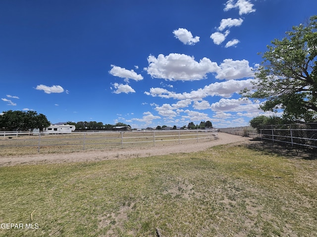 view of yard with a rural view