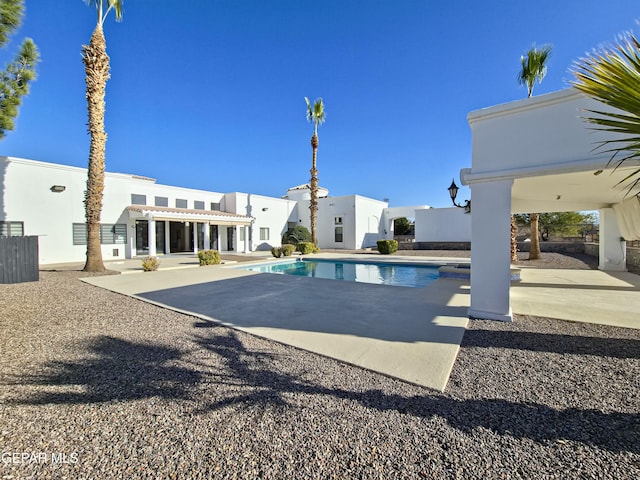 view of swimming pool featuring a patio area