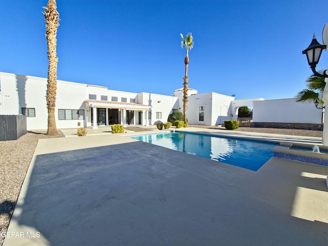 view of pool with an in ground hot tub and a patio area