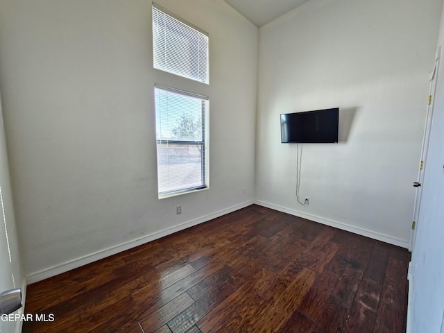 empty room featuring dark hardwood / wood-style floors