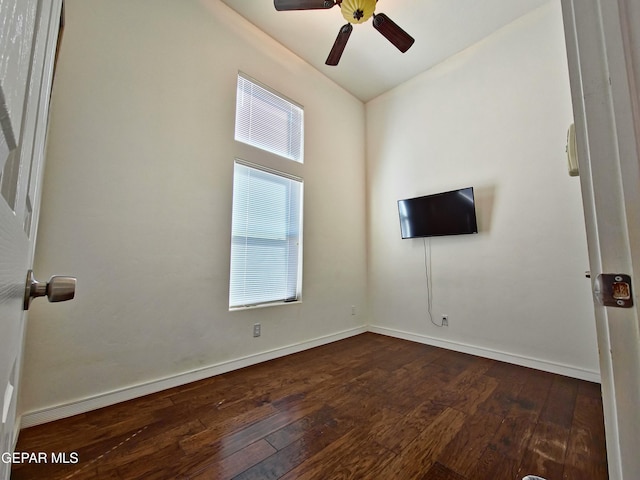 empty room featuring dark hardwood / wood-style floors and ceiling fan