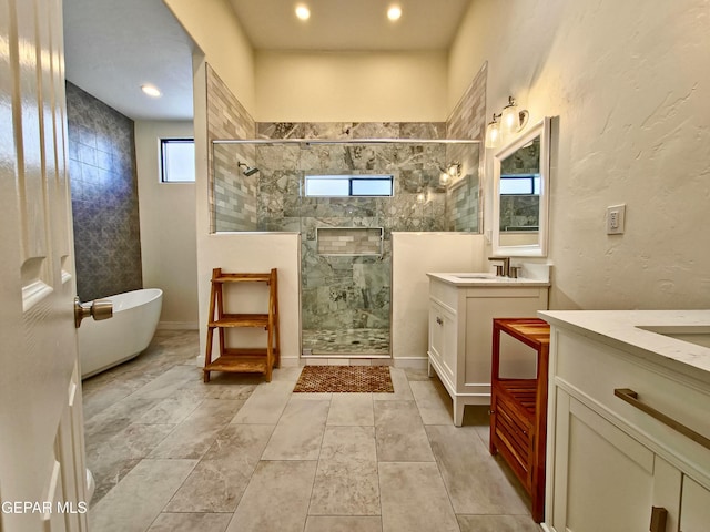 bathroom featuring vanity and shower with separate bathtub