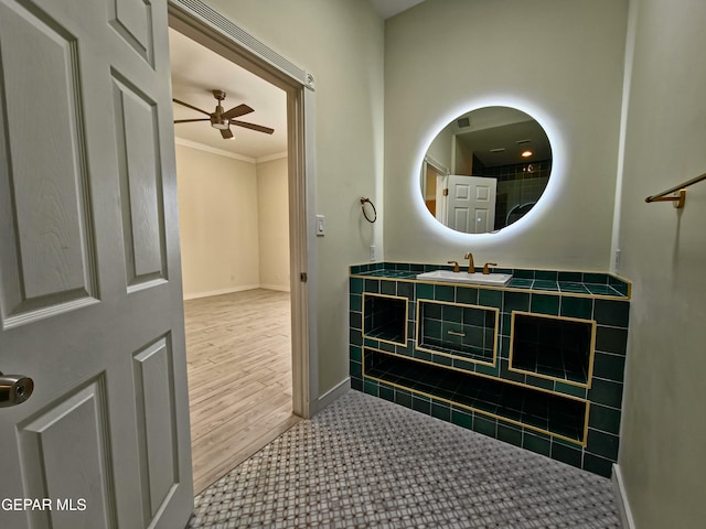 bathroom featuring vanity, ceiling fan, and ornamental molding