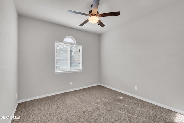 empty room with carpet and ceiling fan