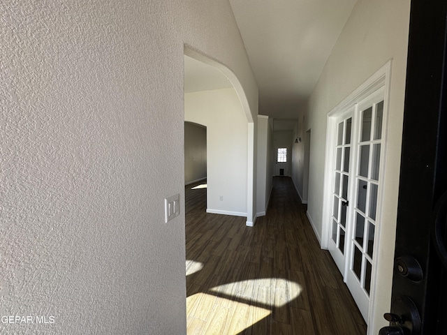 corridor featuring dark hardwood / wood-style flooring