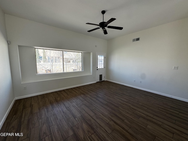 unfurnished room featuring ceiling fan and dark hardwood / wood-style flooring