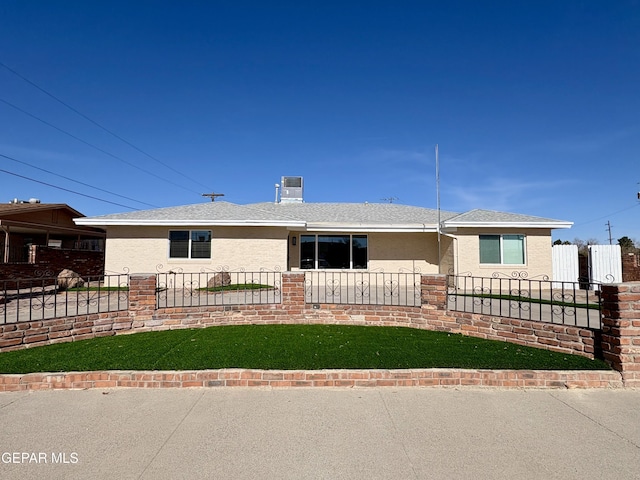 ranch-style house with a front lawn