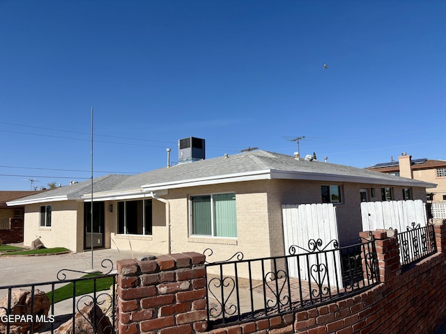 back of house with cooling unit