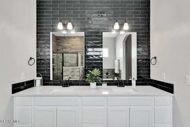 bathroom featuring vanity and an enclosed shower