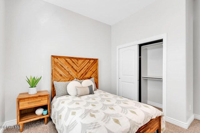 carpeted bedroom featuring a closet