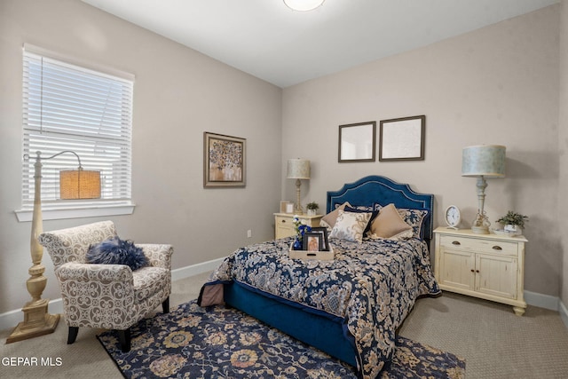 bedroom featuring light carpet