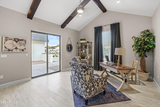 office with vaulted ceiling with beams, ceiling fan, a healthy amount of sunlight, and light hardwood / wood-style flooring