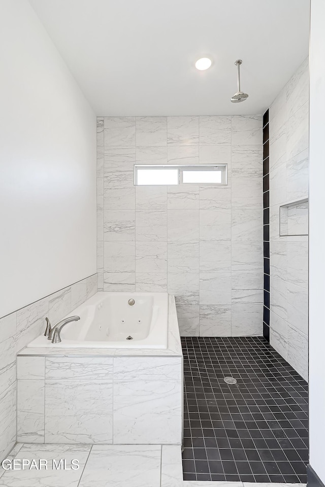 bathroom featuring tile patterned flooring and plus walk in shower