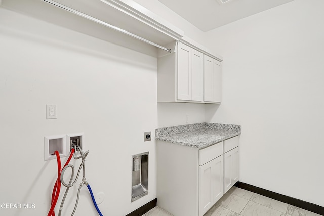 laundry room featuring cabinets, washer hookup, and electric dryer hookup