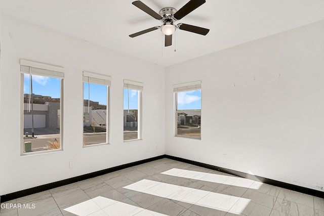 unfurnished room with ceiling fan