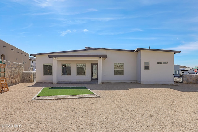 back of house featuring a patio