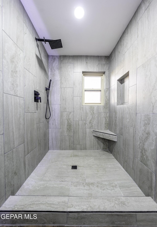 bathroom featuring tiled shower