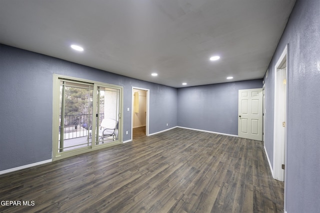 spare room featuring dark wood-type flooring