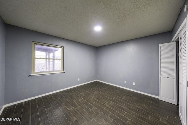 spare room featuring a textured ceiling