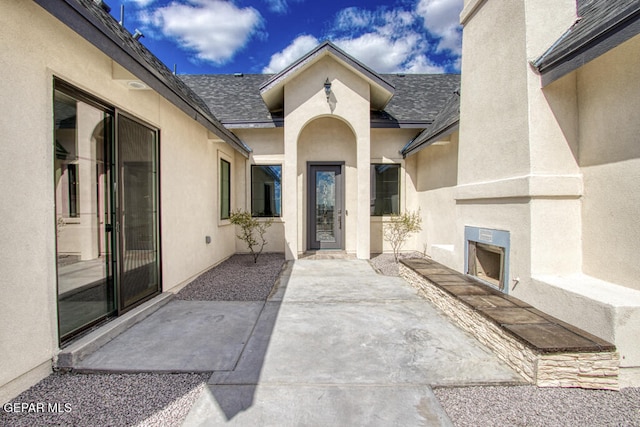 property entrance featuring a patio area