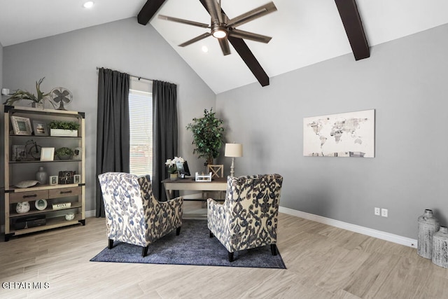 sitting room featuring ceiling fan, lofted ceiling with beams, and light hardwood / wood-style floors