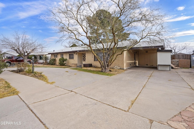 ranch-style house with a carport