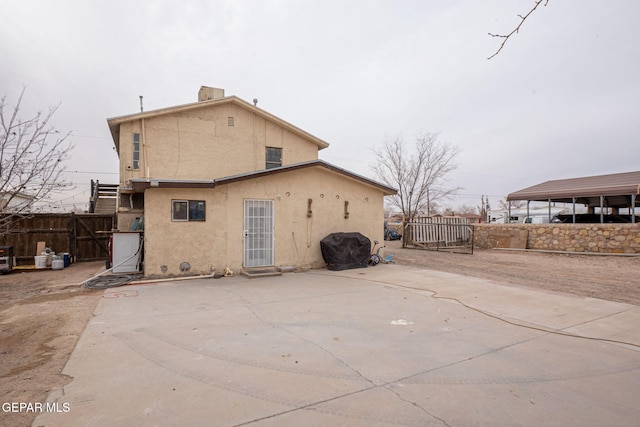 back of property with a patio area